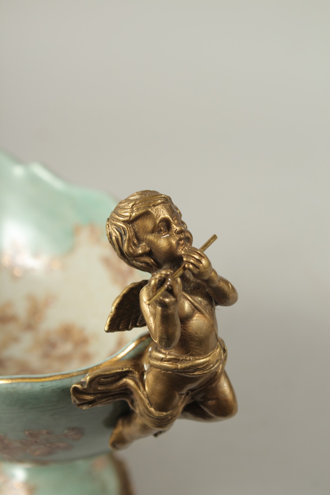 A SEVRES STYLE PORCELAIN AND GILT METAL OVAL COMPORT with cupid handles. 28cms long. - Image 4 of 5