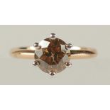 AN 18CT ROSE AND WHITE GOLD SIX CLAW SET RBC DIAMOND SOLITAIRE RING, boxed. Fancy orangish brown