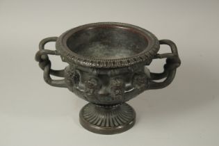AFTER THE ANTIQUE. A GOOD BRONZE WARWICK VASE. 9ins high.