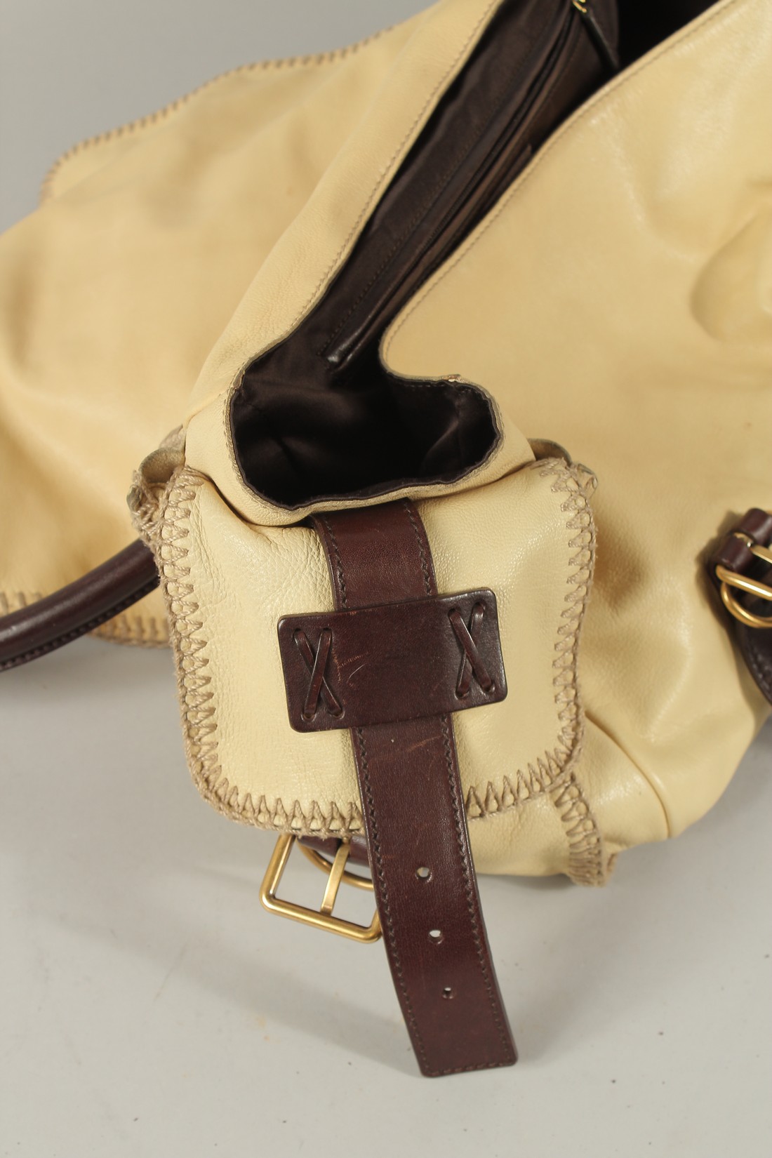 AN YVES SAINT LAURENT, PARIS, SOFT LEATHER BAG with metal clips and leather handles. 40cms long. - Image 5 of 6