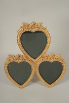 A GILT BRONZE TRIPLE HEART FRAME.