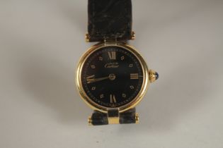 A LADIES' CARTIER MUSTANG BLACK FACED WRISTWATCH, with leather strap. Quartz. Swiss made. 028686
