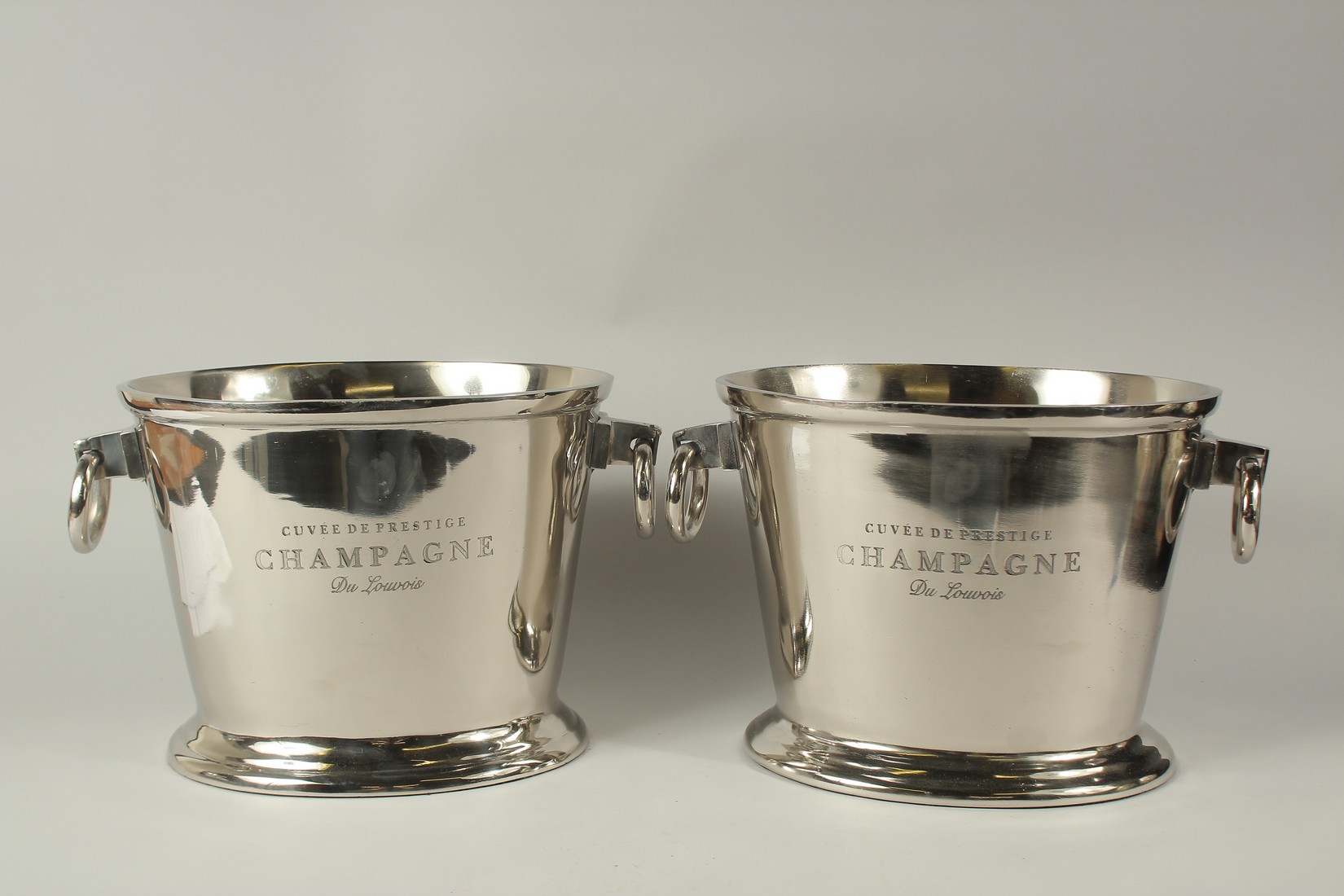 A LARGE PAIR OF OVAL CHAMPAGNE COOLERS with ring handles. 24cms high.