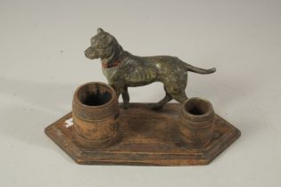 A BLACK FOREST CARVED WOOD DOG AND BARREL SMOKING SET. 25cms long.