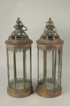 A PAIR OF COPPER LANTERNS. 55cms high.