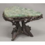 A SUPERB MARBLE TOP TABLE with rustic wooden base. 2ft 4ins long, 1ft 10ins wide at the longest