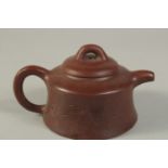 A CHINESE YIXING TEAPOT, with impressed mark to inner lid and base.