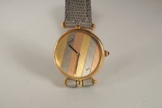 A VAN CLEEF & ARPELS 18CT YELLOW GOLD WRISTWATCH, with a leather strap. 2533218 18382, in a Van