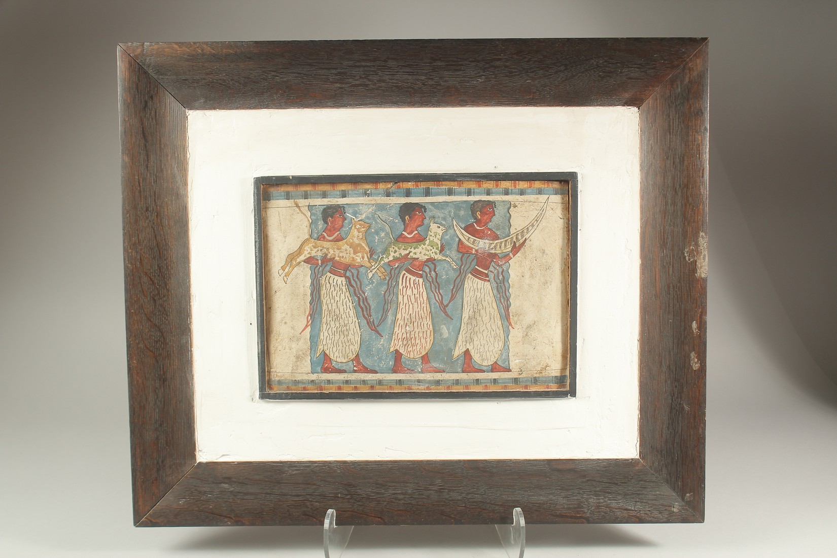 A STUCCO EGYPTIAN PANEL. 9 X 13ins, framed.