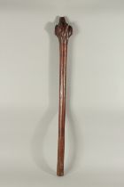 A LARGE HEAVY WOODEN CLUB with etched handle. 42ins long.