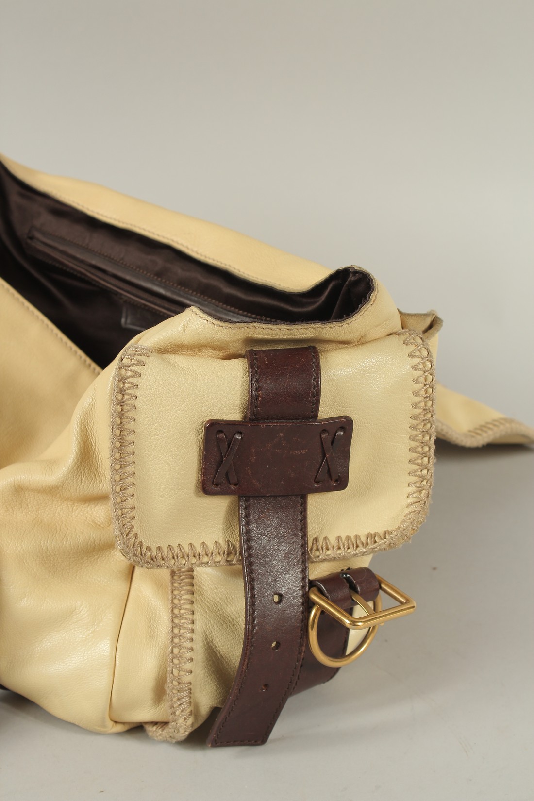 AN YVES SAINT LAURENT, PARIS, SOFT LEATHER BAG with metal clips and leather handles. 40cms long. - Image 4 of 6