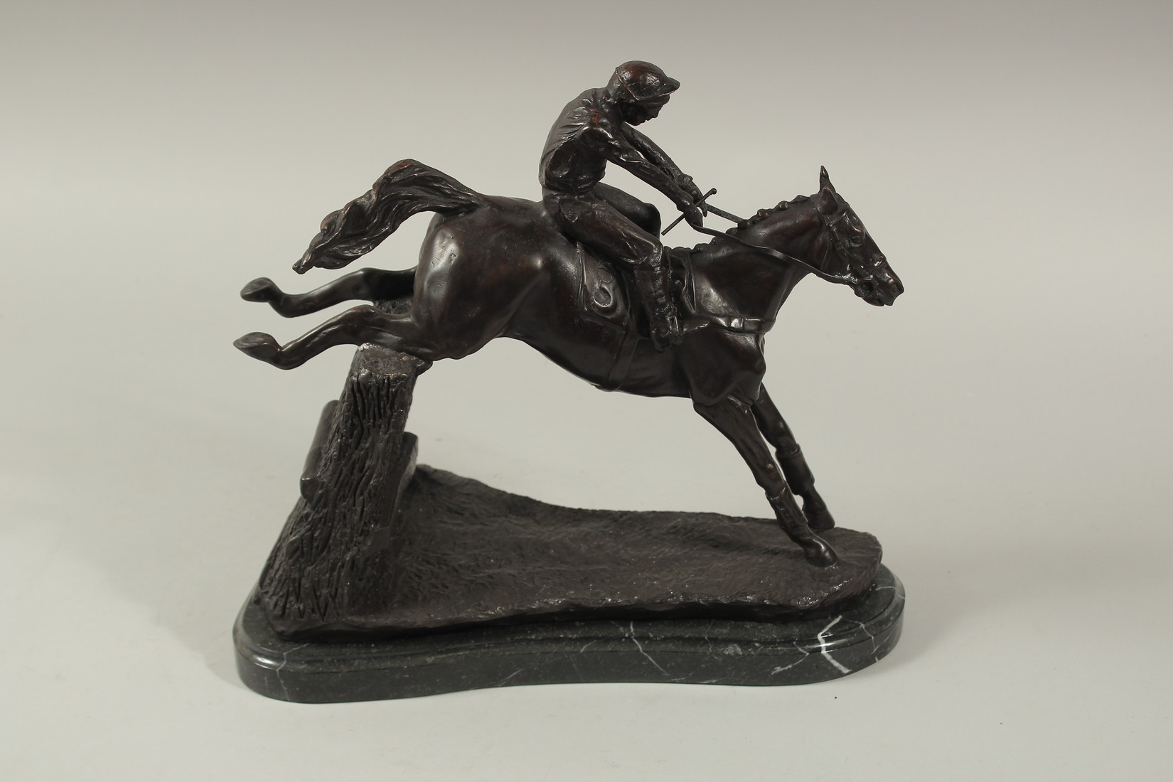 A FINE BRONZE GROUP, HORSE AND JOCKEY OVER THE FENCE, on a marble base. 12ins high. - Image 4 of 6