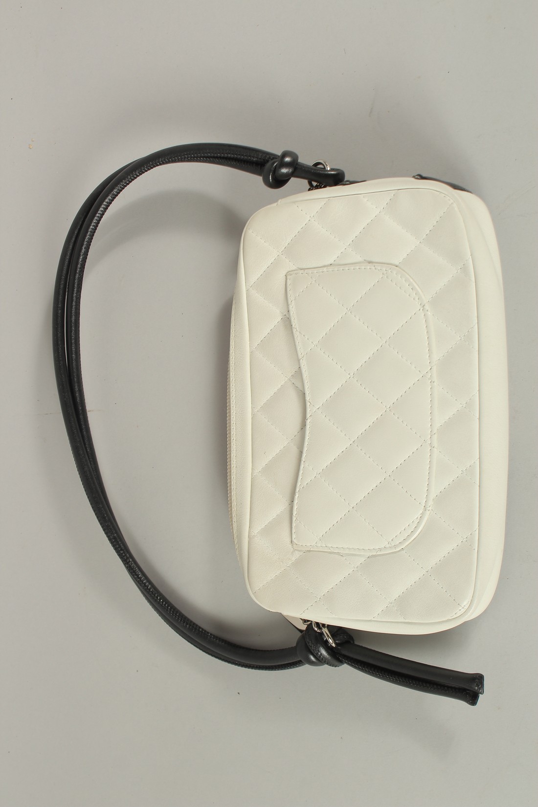 A CHANEL WHITE LEATHER BAG with black CC and handle, with dust cover. 22cms long x 15cms deep. - Image 2 of 6