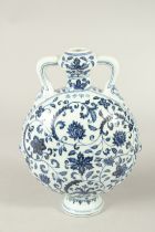 A CHINESE BLUE AND WHITE TWIN HANDLE MOON FLASK. 28cms high.