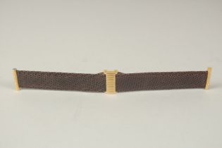 A BOUCHERON BROWN STRAP in a Boucheron case. 17cms long.