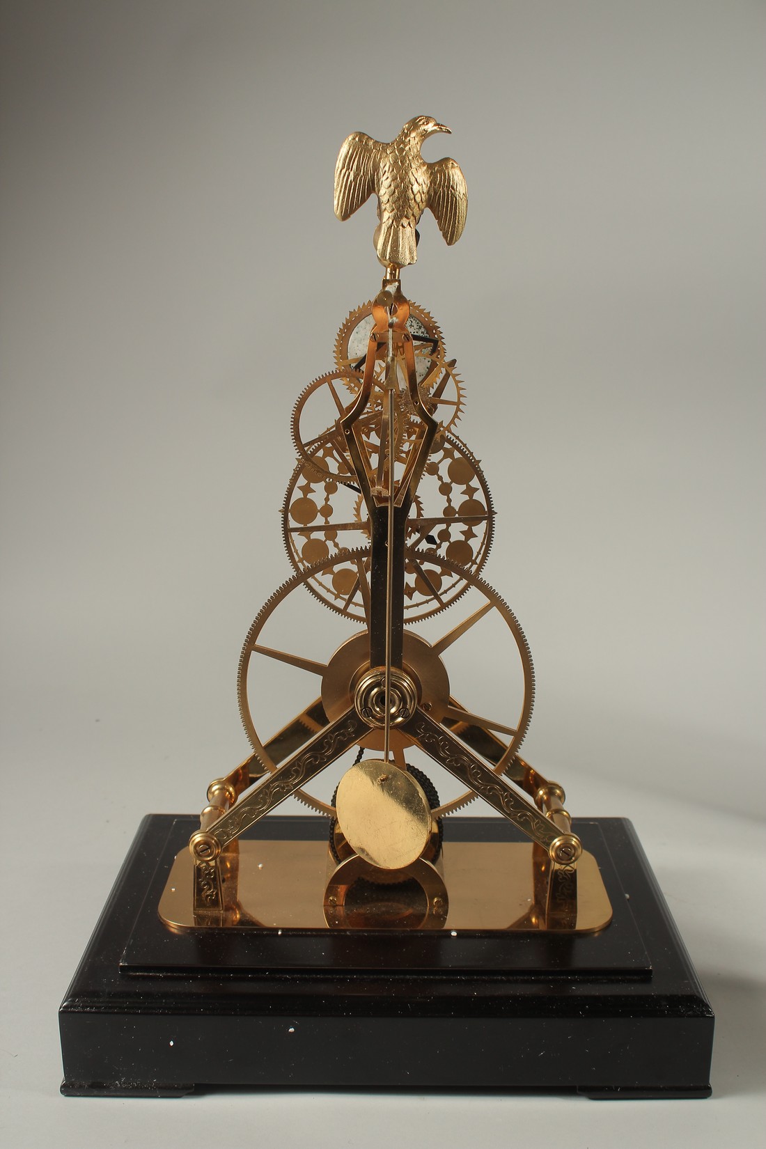 A MOONPHASE BRASS SKELETON CLOCK with eagle, in a glass case. 42cms high. - Image 3 of 3