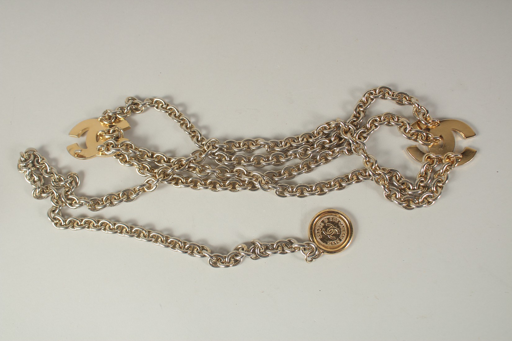 A LONG CHANEL GILT BELT with pendant and tie, double C emblem. 110cms long. - Image 5 of 9