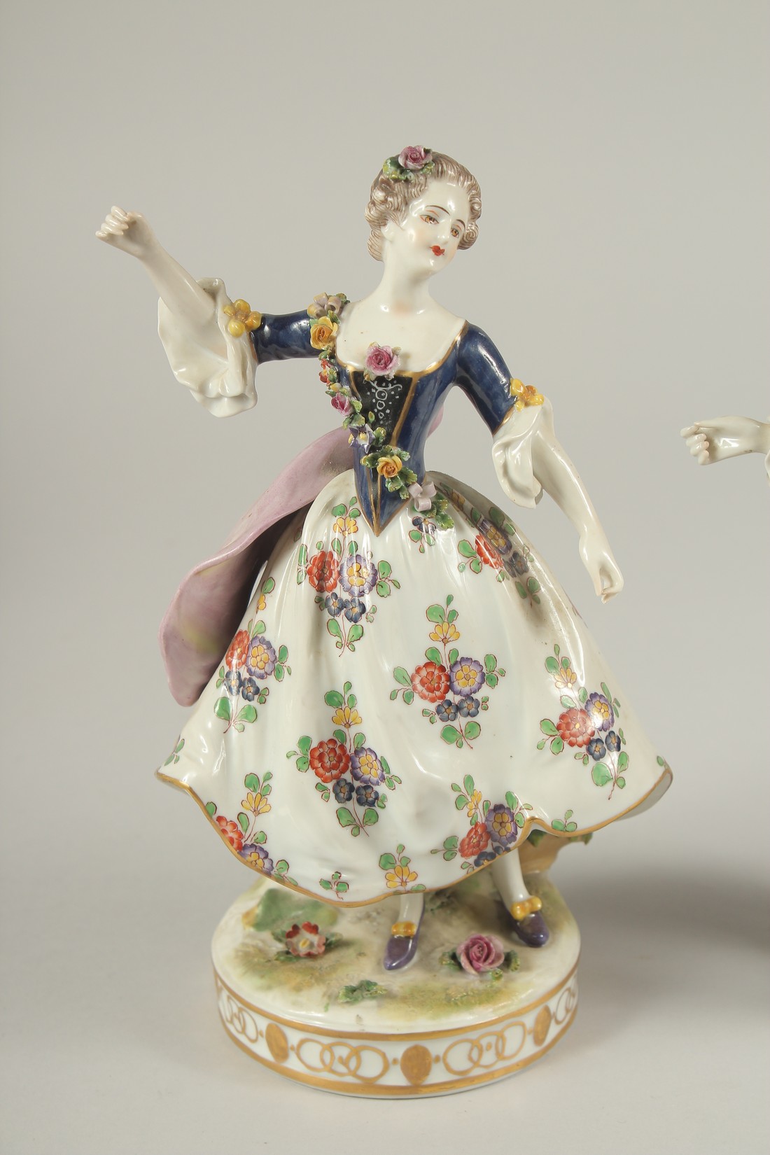 A GOOD PAIR OF PORCELAIN FIGURES OF A GALLANT AND LADY DANCING, on circular bases. 9ins high. - Image 2 of 7