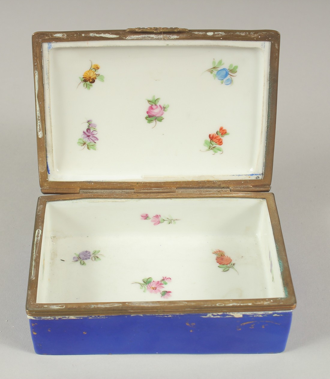A SEVRES PORCELAIN BOX AND COVER with blue ground, with a panel of flowers. 5ins long. - Image 3 of 6