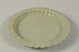 A CHINESE GUAN WARE CRACKLE GLAZE DISH. 18.5cms diameter.