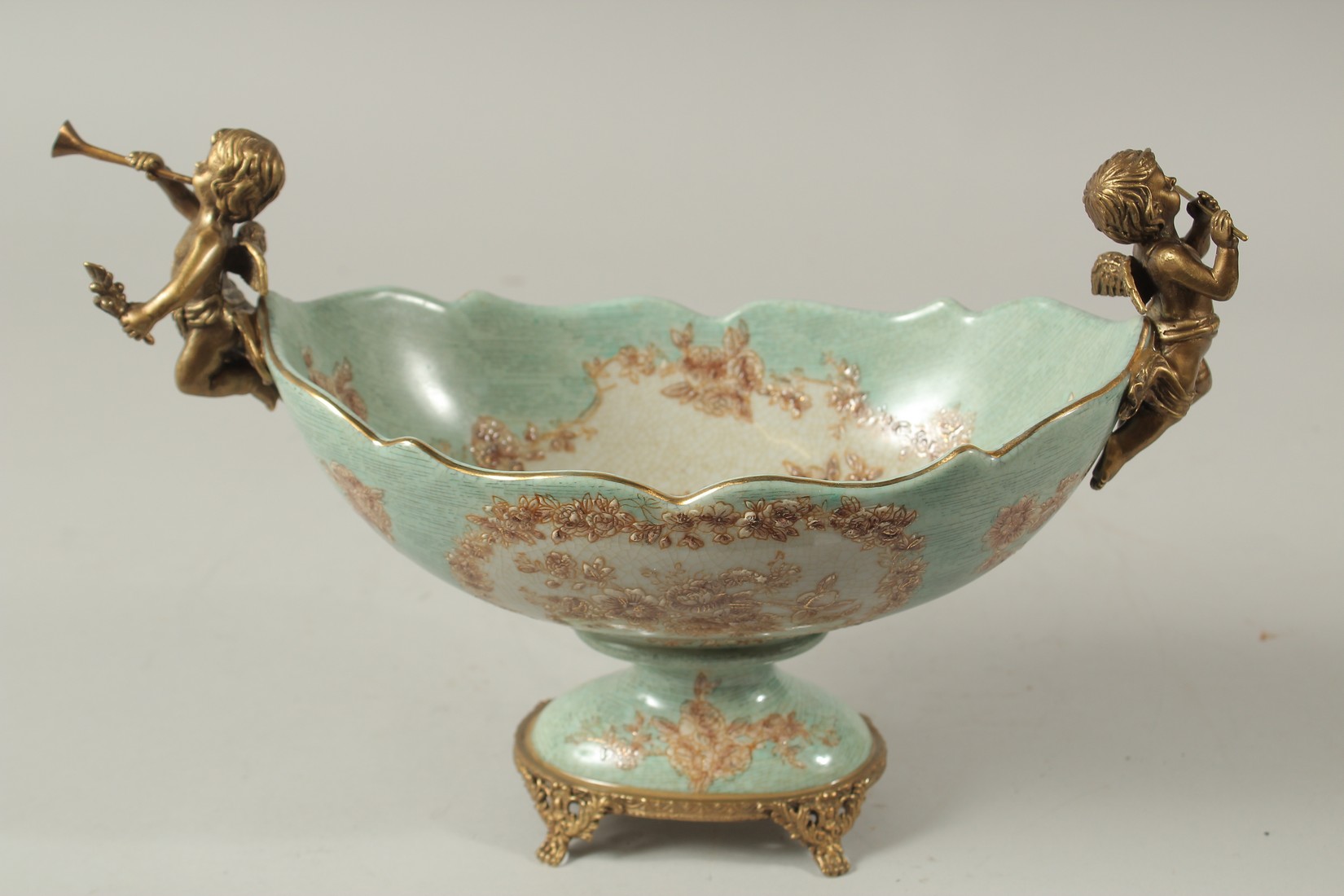 A SEVRES STYLE PORCELAIN AND GILT METAL OVAL COMPORT with cupid handles. 28cms long. - Image 3 of 5