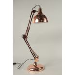 A COPPER ANGLE POISE LAMP.