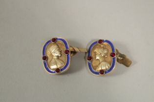 A PAIR OF RUSSIAN SILVER AND ENAMEL CUFFLINKS depicting the busts of a man and woman.