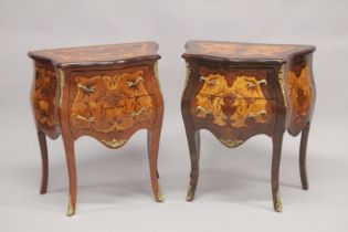 A PAIR OF LOUIS XVITH DESIGN INLAID BOMBE FRONTED COMMODES, each with two drawers, on curving