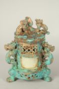 A CHINESE GILDED CYLINDRICAL LIDDED POT. 19cms high.