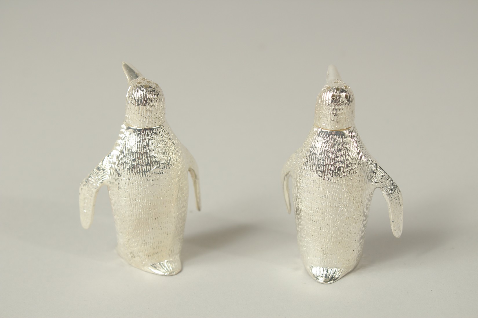 A SMALL PAIR OF PLATED PENGUIN SALTS AND PEPPERS. 3cms high. - Image 2 of 2