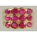 AN UNUSUAL 14CT YELLOW GOLD RING SET WITH TWELVE RUBIES (2.00ct approx.), boxed.