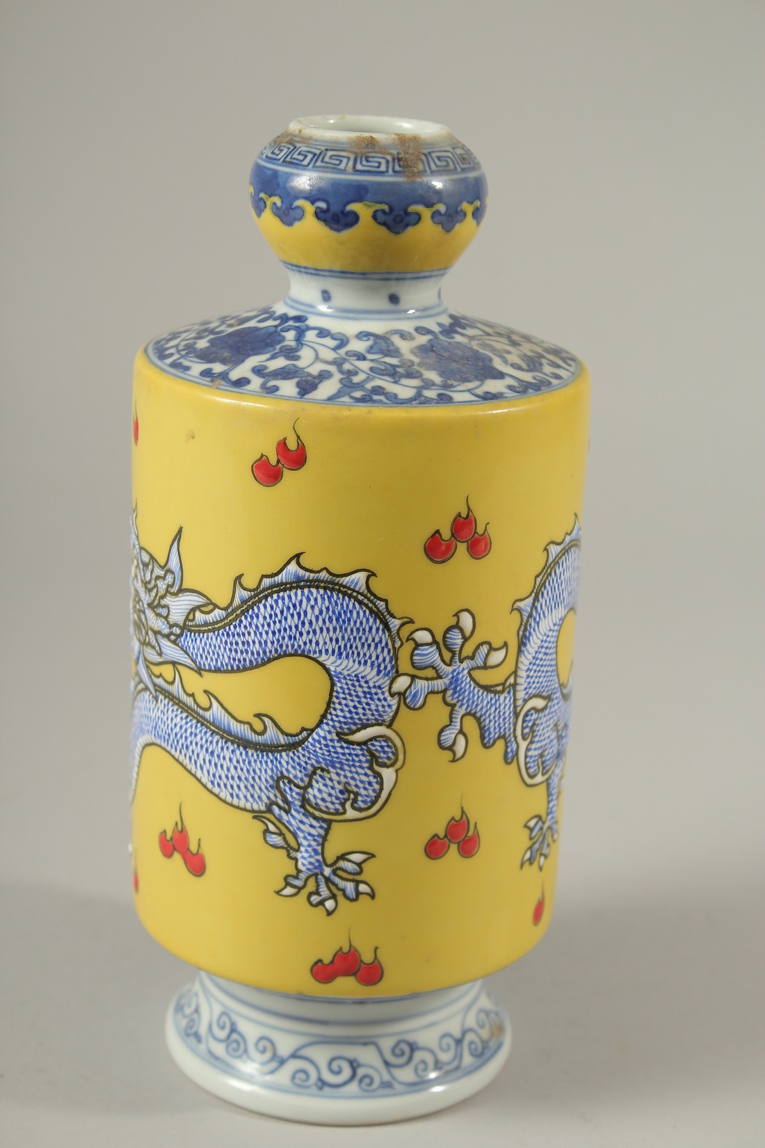 A CHINESE PORCELAIN YELLOW GROUND VASE decorated with dragons. 21cms high. - Image 2 of 4