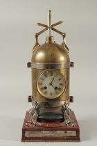 A GOOD 19TH CENTURY BRASS AND BRONZE INDUSTRIAL CLOCK formed as a cylinder supported on four dolphin