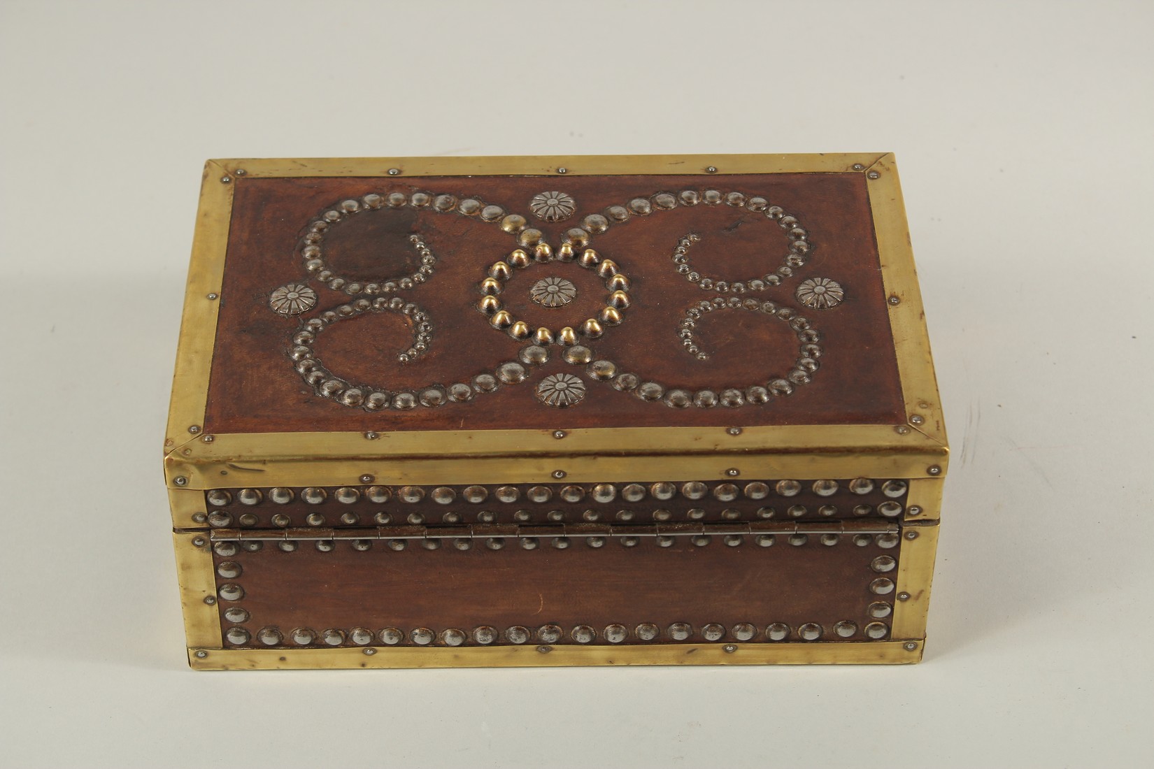 A BRASS BANDED AND STUDDED LEATHER BOX. 10ins long x 4ins high x 6ins deep. - Image 4 of 5