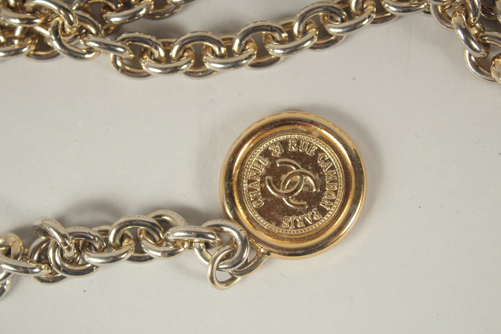 A LONG CHANEL GILT BELT with pendant and tie, double C emblem. 110cms long. - Image 8 of 9