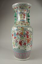 A LARGE CHINESE CANTON PORCELAIN VASE painted with panels of figures, birds and flower motifs. 58cms