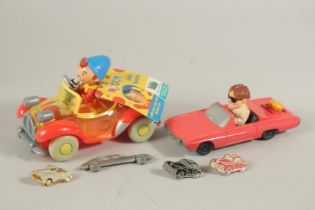 TWO NODDY TOY CARS AND BADGES.