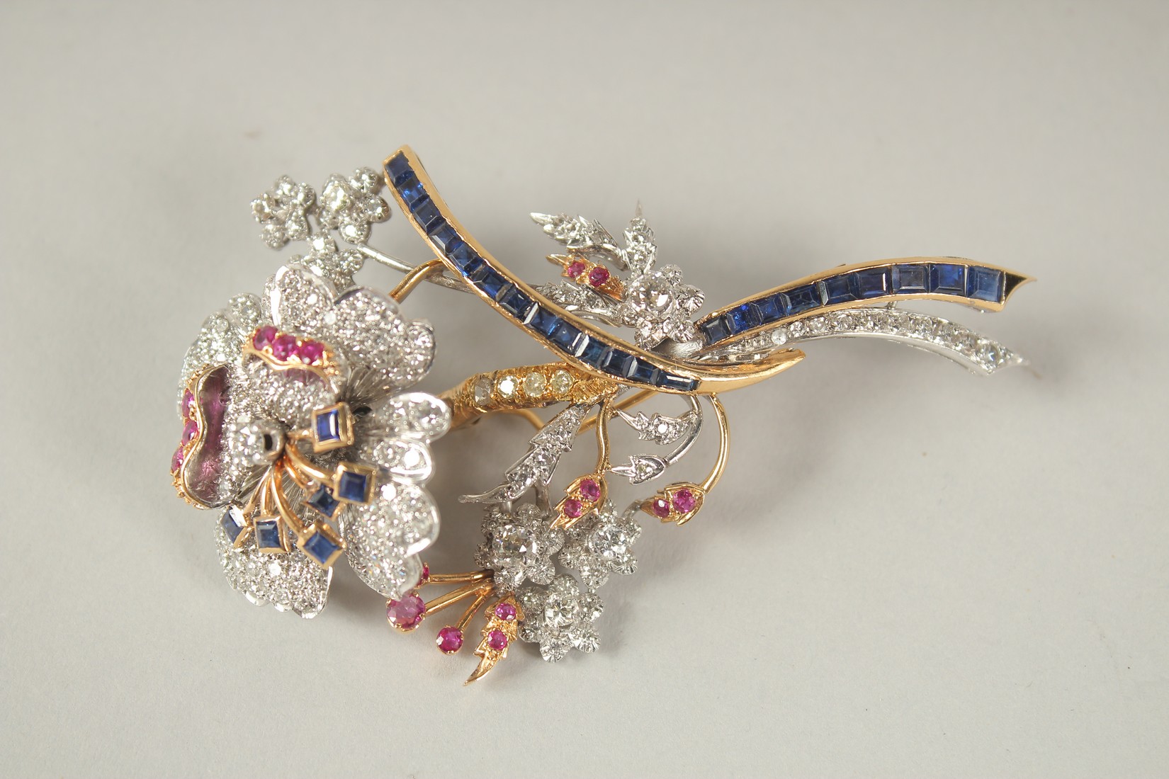 A SUPERB 18CT GOLD, DIAMOND, RUBY AND SAPPHIRE TREMBLING FLOWER BROOCH. 35grams.