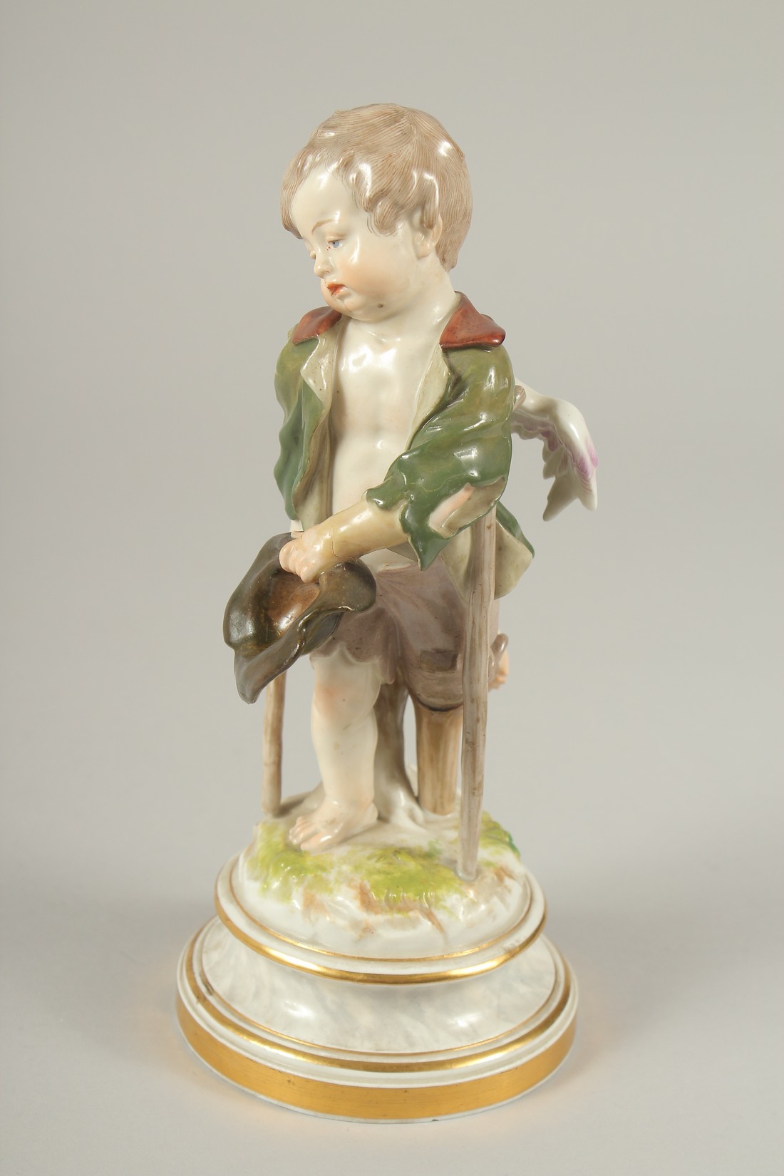 A MEISSEN PORCELAIN FIGURE "CUPID AS A BEGGAR" from the Love Series. Cross swords mark in blue. - Image 4 of 6