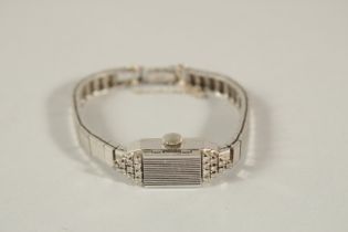 A LADIES 14CT WHITE GOLD AND DIAMOND COCKTAIL WATCH.