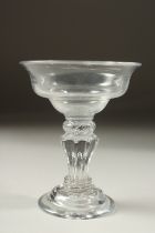A GEORGIAN CHAMPAGNE GLASS with large bowl and fluted stem. 5ins high.
