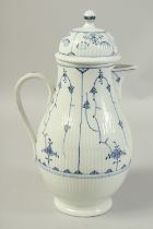 A LARGE VOLKSTEDT COFFEE POT decorated with a stylised flower decoration in under glaze blue. Circa.