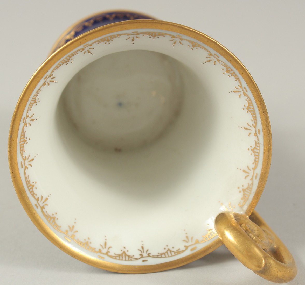 A GOOD DRESDEN CUP AND SAUCER with blue ground, painted with an oval of a lady carrying a tray. - Image 8 of 9