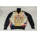 A HERMES NAVY SILK AND WOOL PATTERN POLO NECK SWEATER.