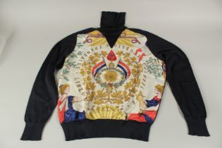 A HERMES NAVY SILK AND WOOL PATTERN POLO NECK SWEATER.