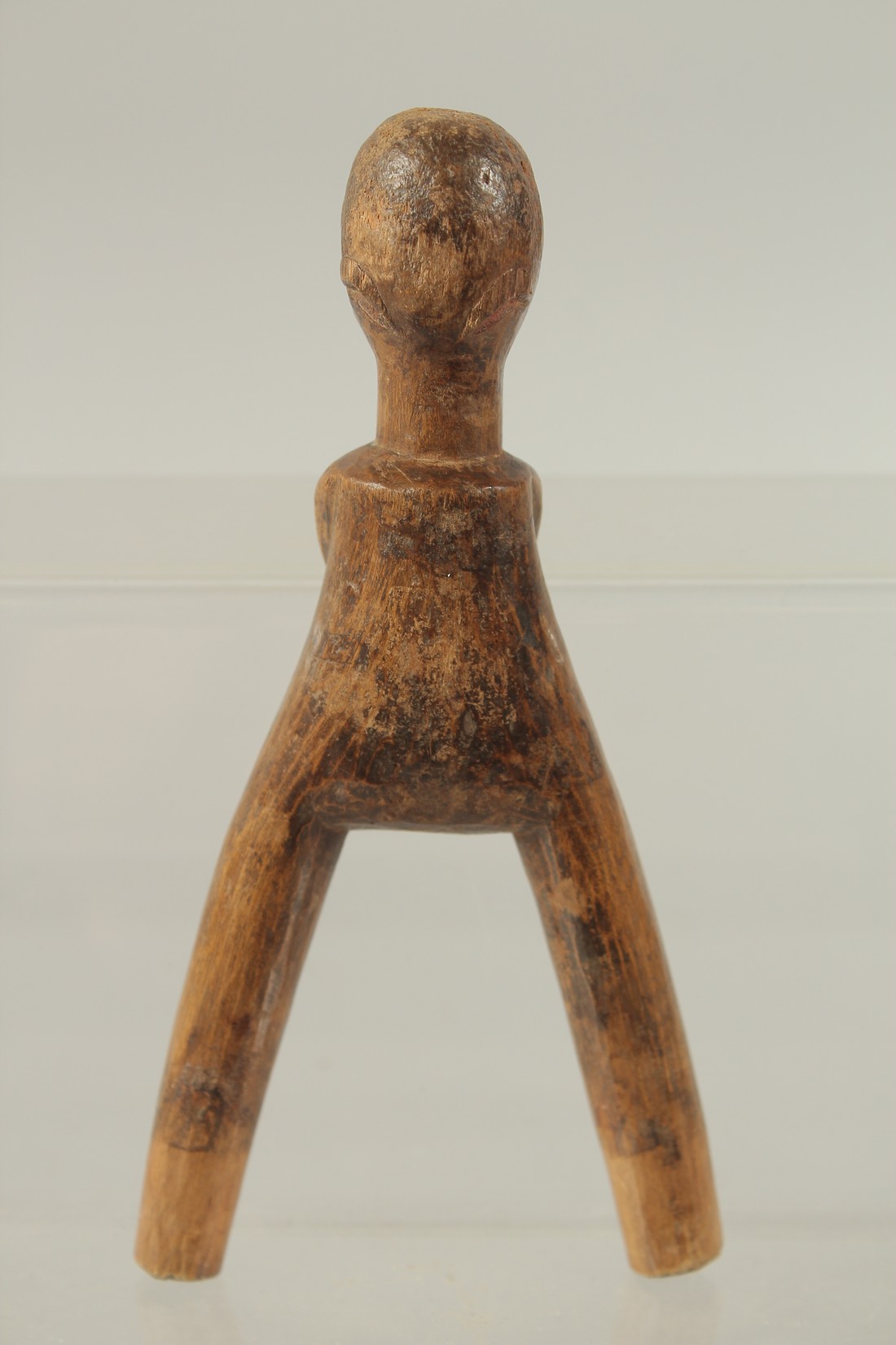 A CARVED WOOD TRIBAL CATAPAULT formed as a man. 7ins high. - Image 2 of 2