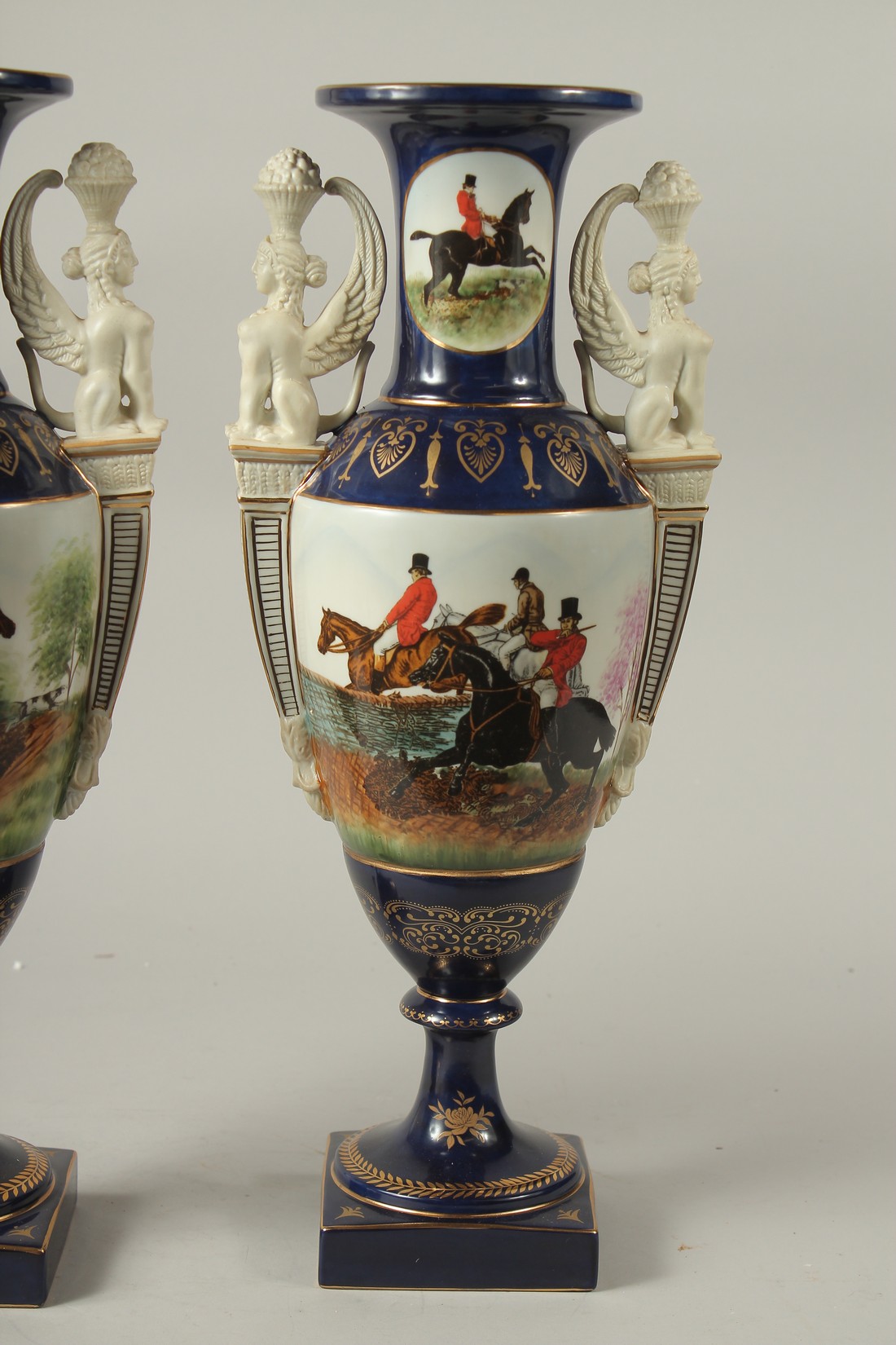 A PAIR OF SEVRES DESIGN BLUE GROUND TWO HANDLED HUNTING VASES. 46cms high. - Image 3 of 5
