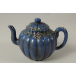A BLUE YIXING TEAPOT AND COVER.