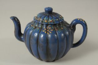 A BLUE YIXING TEAPOT AND COVER.