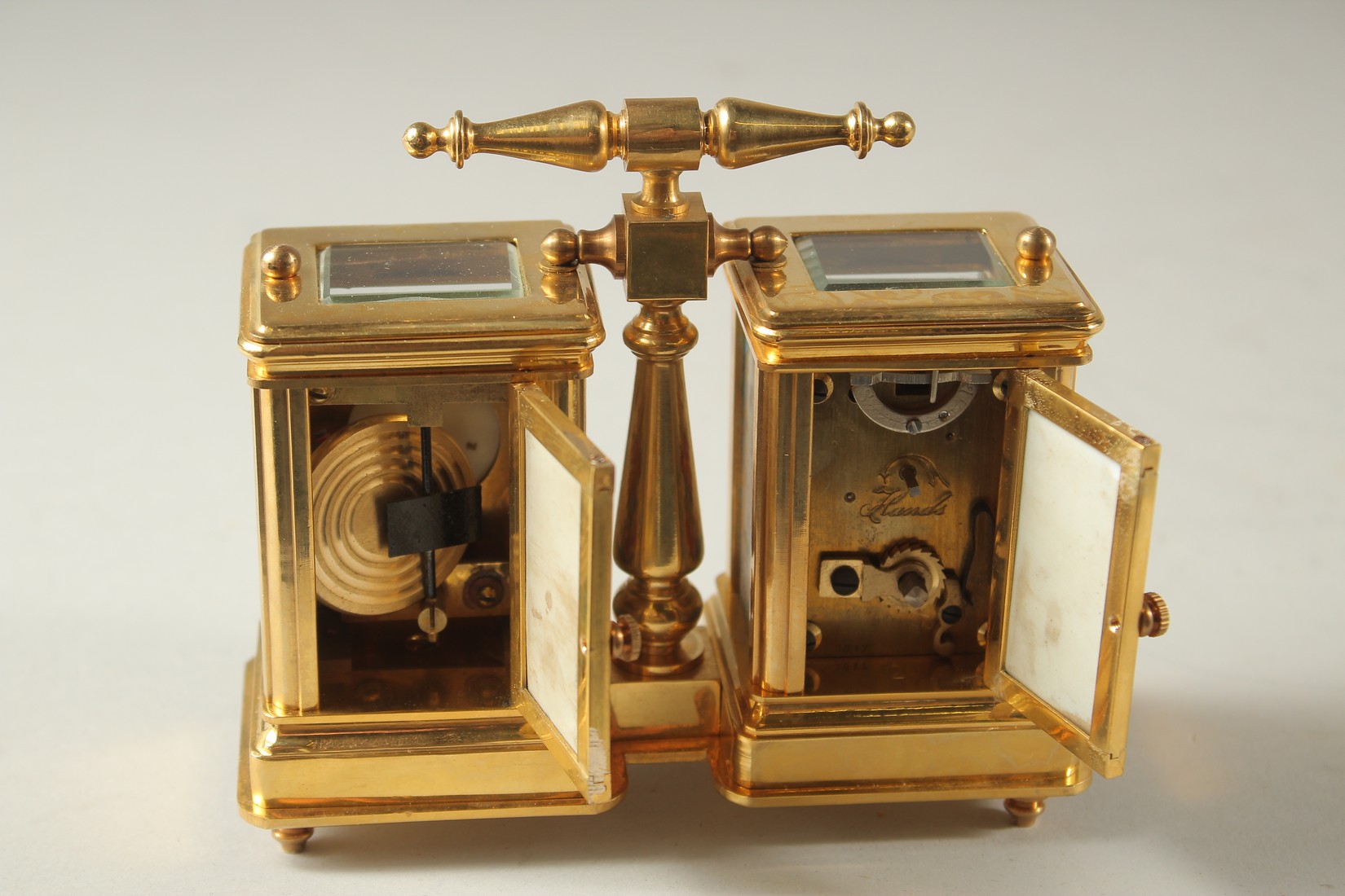 A SEVRES MODEL DOUBLE CARRIAGE CLOCK with porcelain panels and carrying handles. 10cms high. - Image 2 of 2